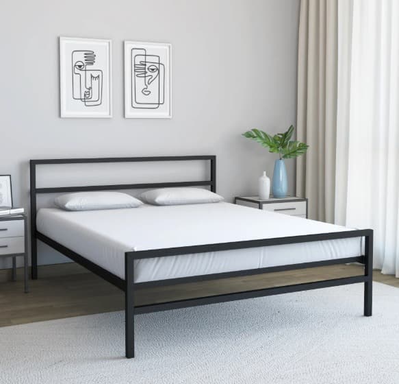 Minimal black metal bed with white bedding in a bright room with abstract art and modern decor.