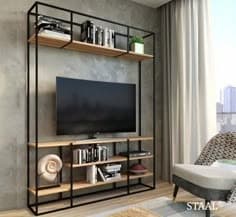 Modern metal-frame TV unit with open wooden shelves, housing a flat-screen TV, books, and decorative items in a cozy living room.