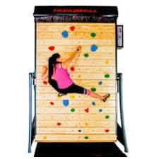 Woman climbing on a wooden-panel Treadwall with colorful holds, designed for continuous climbing and training.